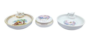 three bowls and a bowl with a lid on a white background