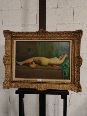 tableau représentant une femme nue allongée sur un lit dans une chambre