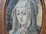 a mosaic of a woman with a crown on her head