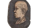 an old picture of a young boy in a black and gold frame