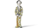 une image représentant une figurine d'une femme vêtue d'un kimono