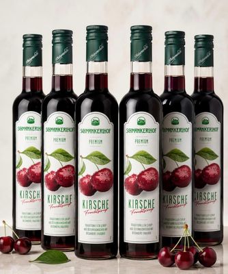 four bottles of cherries are lined up on a table