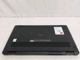 a black laptop with a red button sitting on a white surface