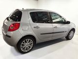 a silver car that is parked in a white room