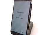 a cell phone that is sitting on top of a stand