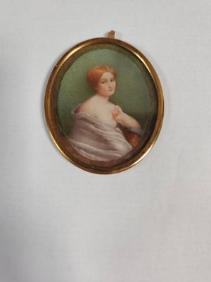 miniature portrait of a woman in a white dress in a gold frame