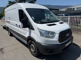 the white van is parked on the side of the road