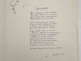 an open book with a handwritten poem on it sitting on top of a table