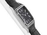 a close up of a wrist watch on a white surface
