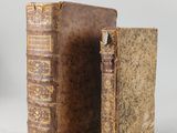 an old book is open to show the inside of it