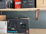 many wine glasses and boxes on the shelves in the room