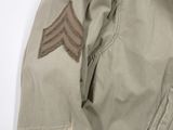 the back of a military jacket with a chevroned patch on it