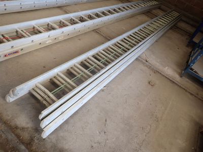 four ladders that are sitting on the floor