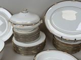 a lot of plates and bowls that are stacked together