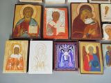 many different religious icons displayed on the wall