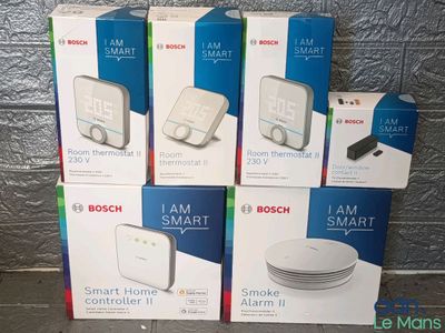 four boxes of bosch smart smart home appliances sitting on a table
