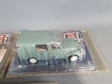 a green toy truck in a plastic box on a table