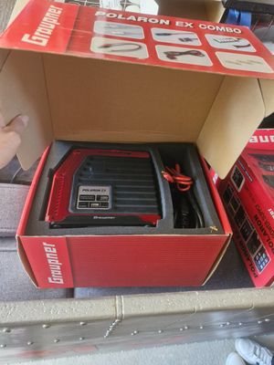 a box with a battery in it and a box with a charger inside of it