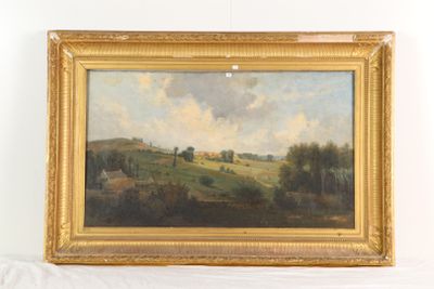 tableau représentant un paysage, dans un cadre doré, posé sur un support blanc