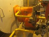 a yellow pipe and some pipes in a room
