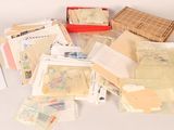 many different types of stamps and envelopes on the table