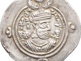 a close up of a coin with a crown on it