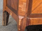 a wooden cabinet that has a door on the top of it
