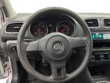 dashboard of a car with a steering wheel and dashboard gauges