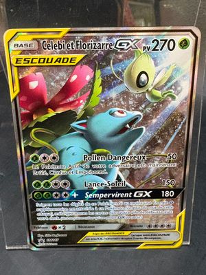 a pokemon card on display in a glass case
