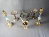 a lot of antique items that are sitting on a table