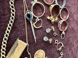 many different types of jewelry on a purple surface