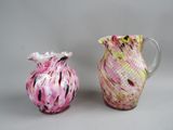 two vases sitting next to each other on a table