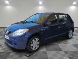 the small blue car is parked in a room with a checkered floor