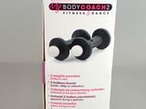 a box with two black and white body coach plugs in it