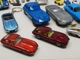 a lot of toy cars that are on a table