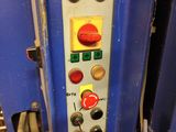 an image of a machine that is working on a piece of machinery