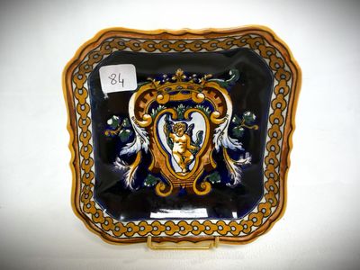a decorative plate with a picture of a woman on it