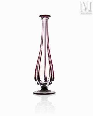 a glass vase that is sitting on a table