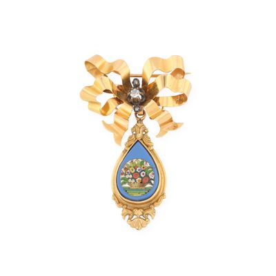 une image représentant une broche bleue et dorée ornée d'une fleur