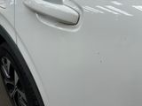 a close up of a car door handle with a sticker on it