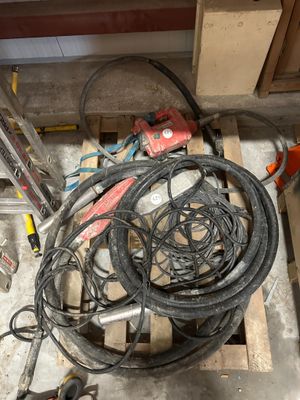a pile of wires and tools on the floor