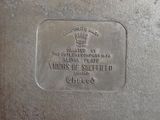 an old silver plate with a plaque on it that says, the united states of america and the united states