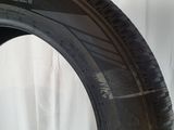 a close up of a tire on a white surface with a white background