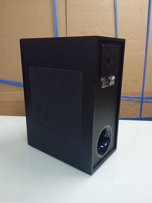 an image of a black speaker sitting on top of a white table