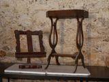two chairs and a table with a mirror on top of it