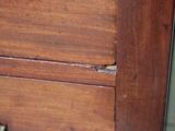 a close up of a drawer with a clock on top of it