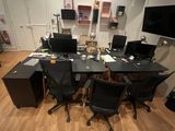 an image of a room with a desk and a tv