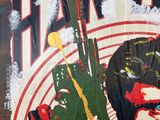 a painting of a man with a gun on a wall