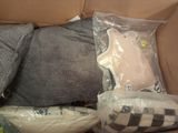 a cardboard box with a stuffed animal in it