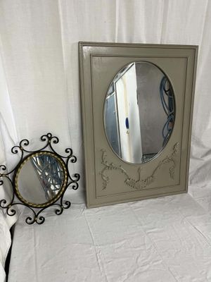 a mirror and a mirror frame sitting on a table